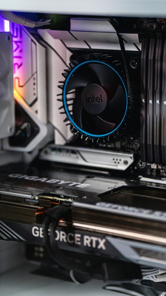 Close-up of a gaming PC showcasing GeForce RTX graphics card and Intel CPU fan.